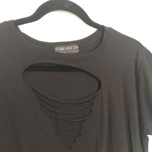 Black tee shirt with ripped holes in the front